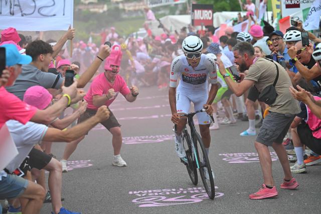 TOPSHOT - Bahrain - Victorious Portuguese rider Afonso Eulalio breakaway in the Muro di Ca’ del Poggio during the 18th stage of the Giro d'Italia 2026 - Tour of Italy cycling race between Fai della Paganella and Pieve di Soligo, Italy, on 28 May 2026. (Photo by Tim De Waele / POOL / AFP)