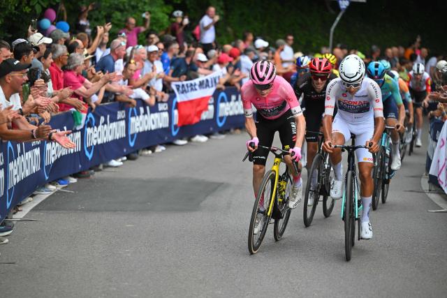 Bahrain - Victorious Portuguese rider Afonso Eulalio rides next to Team Visma Lease a Bike Danish rider Jonas Vingegaard in the Muro di Ca’ del Poggio during the 18th stage of the Giro d'Italia 2026 - Tour of Italy cycling race between Fai della Paganella and Pieve di Soligo, Italy, on 28 May 2026. (Photo by Tim De Waele / POOL / AFP)