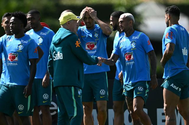 Brazil's Italian head coach Carlo Ancelotti (L) greets defender Wesley during a training session at the Granja Comary training center in Teresopolis, Rio de Janeiro, Brazil, on May 28, 2026, ahead of the FIFA World Cup 2026. (Photo by MAURO PIMENTEL / AFP)