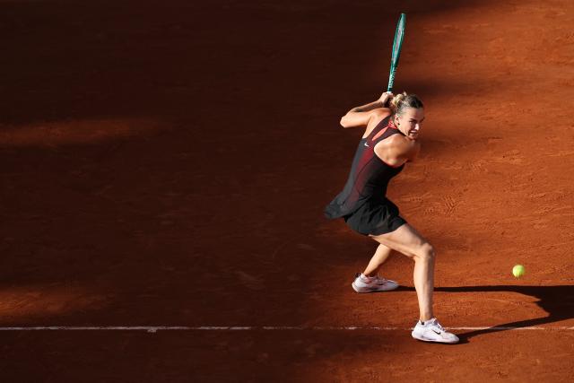 Aryna Sabalenka plays a backhand return to France's Elsa Jacquemot during their women's singles match on day 5 of the French Open tennis tournament on Court Philippe-Chatrier at the Roland-Garros Complex in Paris on May 28, 2026. (Photo by ALAIN JOCARD / AFP)