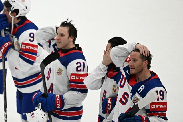 USA's forward #19 Matthew Tkachuk (R) reacts with teammates after the IIHF Ice Hockey Men's World Championship quarter-final match between Canada and USA in Fribourg, Switzerland on May 28, 2026. (Photo by Fabrice COFFRINI / AFP)