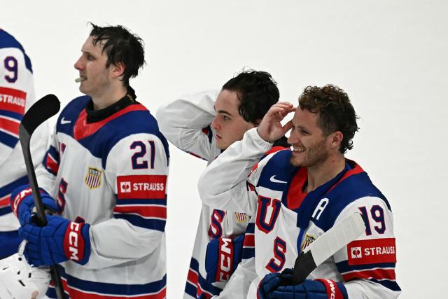 USA's forward #19 Matthew Tkachuk (R) reacts with teammates after the IIHF Ice Hockey Men's World Championship quarter-final match between Canada and USA in Fribourg, Switzerland on May 28, 2026. (Photo by Fabrice COFFRINI / AFP)