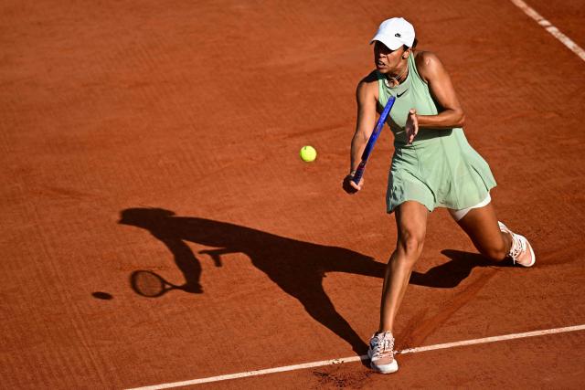 US Madison Keys plays a backhand return to Croatia's Antonia Ruzic during their women's singles match on day 5 of the French Open tennis tournament at the Roland-Garros Complex in Paris on May 28, 2026. (Photo by JULIEN DE ROSA / AFP)