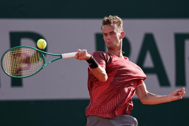 France's Luca Van Assche plays a forehand return to US Brandon Nakashima during their men's singles match on day 5 of the French Open tennis tournament at the Roland-Garros Complex in Paris on May 28, 2026. (Photo by Anne-Christine POUJOULAT / AFP)