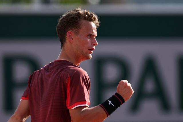 France's Luca Van Assche reacts after a point as he plays against US Brandon Nakashima during their men's singles match on day 5 of the French Open tennis tournament at the Roland-Garros Complex in Paris on May 28, 2026. (Photo by Anne-Christine POUJOULAT / AFP)