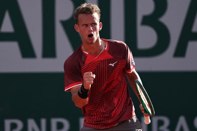 France's Luca Van Assche reacts after a point as he plays against US Brandon Nakashima during their men's singles match on day 5 of the French Open tennis tournament at the Roland-Garros Complex in Paris on May 28, 2026. (Photo by Anne-Christine POUJOULAT / AFP)