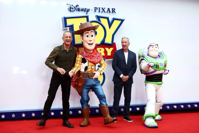 US actor Tom Hanks (L) and US actor Tim Allen (2R) pose upon red carpet during the UK launch event of the film 'Toy Story 5' in London on May 28, 2026. (Photo by Henry Nicholls / AFP)