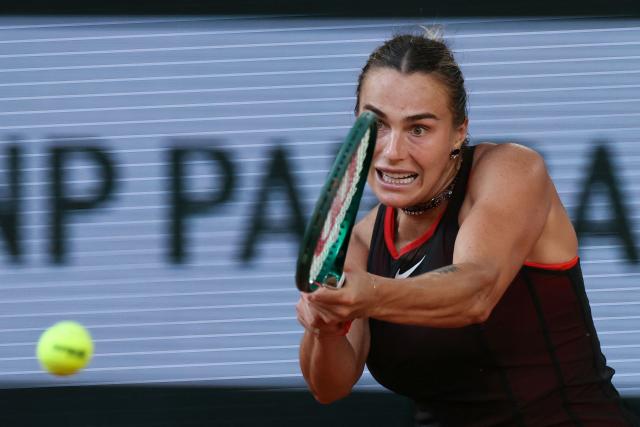 Aryna Sabalenka plays a backhand return to France's Elsa Jacquemot during their women's singles match on day 5 of the French Open tennis tournament on Court Philippe-Chatrier at the Roland-Garros Complex in Paris on May 28, 2026. (Photo by ALAIN JOCARD / AFP)