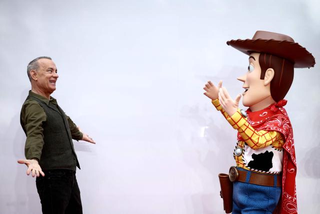 US actor Tom Hanks poses with his character Woody, upon arrival to attend the red carpet for the UK launch event of the film 'Toy Story 5' in London on May 28, 2026. (Photo by Henry NICHOLLS / AFP)