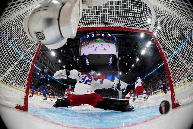 Czech Republic's goalkeeper #32 Josef Korenar attempts to stop the puck during the IIHF Ice Hockey Men's World Championship quarter-final match between Finland and Czech Republic at the Swiss Life Arena in Zurich, Switzerland on May 28, 2026. (Photo by CLAUDIO THOMA / POOL / AFP)