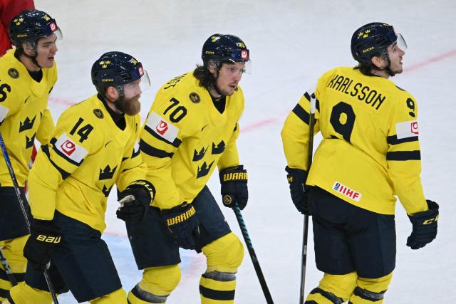 Sweden's forward #70 Oskar Sundqvist (2nd R) celebrates scoring his team's second goal during the IIHF Ice Hockey Men's World Championship quarter-final match between Switzerland and Sweden at the Swiss Life Arena in Zurich, on May 28, 2026. (Photo by SEBASTIEN BOZON / AFP)