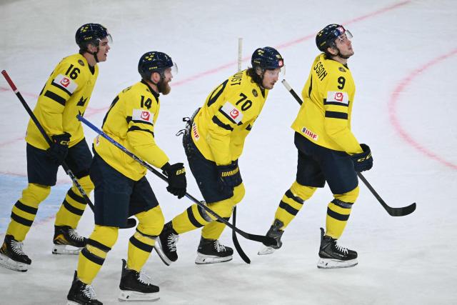Sweden's forward #70 Oskar Sundqvist (2nd R) celebrates scoring his team's second goal during the IIHF Ice Hockey Men's World Championship quarter-final match between Switzerland and Sweden at the Swiss Life Arena in Zurich, on May 28, 2026. (Photo by SEBASTIEN BOZON / AFP)