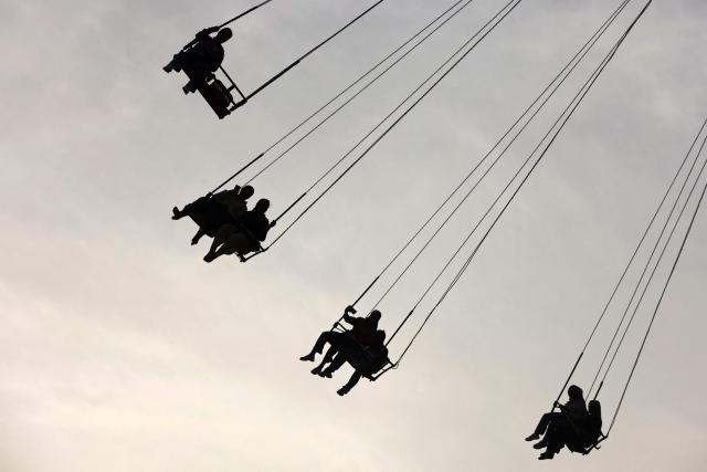 People sit in a ride at an amusement park in the Mansour district of Baghdad on May 28, 2026 on the second day of Eid al-Adha, the Feast of Sacrifice, which marks the end of the annual Hajj pilgrimage to Mecca and commemorates the Prophet Abraham's willingness to sacrifice his son in obedience to God. (Photo by AHMAD AL-RUBAYE / AFP)