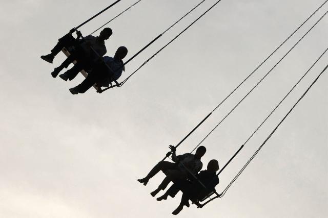 People sit in a ride at an amusement park in the Mansour district of Baghdad on May 28, 2026 on the second day of Eid al-Adha, the Feast of Sacrifice, which marks the end of the annual Hajj pilgrimage to Mecca and commemorates the Prophet Abraham's willingness to sacrifice his son in obedience to God. (Photo by AHMAD AL-RUBAYE / AFP)