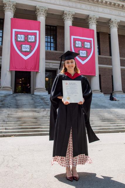 This photo taken on May 27, 2026 shows Princess Elisabeth of Belgium posing in her cap and gown and holding her diploma at Harvard Yard at Harvard University in Cambridge, Massachusetts. Princess Elisabeth, the heir apparent to the Belgian throne, is graduating with a Master's degree in Public Policy from Harvard Kennedy School. (Photo by Joseph Prezioso / AFP)