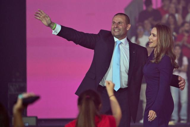 Malta's Prime Minister and leader of the Labour Party Robert Abela and his wife Lydia Abela wave to supporters during an election campaign rally in the capital city of Valletta on May 28, 2026. Malta's general elections will be held on May 30 to elect all members of the House of Representatives. (Photo by Alberto PIZZOLI / AFP)
