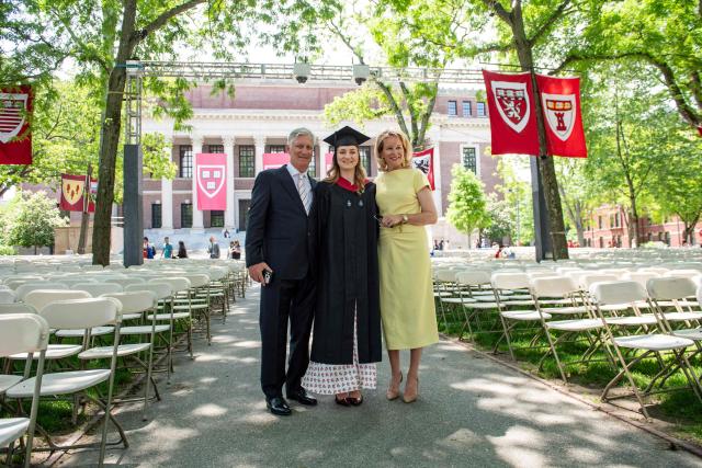 This photo taken on May 27, 2026 shows Princess Elisabeth of Belgium posing in her cap and gown next to her parents King Philippe and Queen Mathilde at Harvard Yard at Harvard University in Cambridge, Massachusetts. Princess Elisabeth, the heir apparent to the Belgian throne, is graduating with a Master's degree in Public Policy from Harvard Kennedy School. (Photo by Joseph Prezioso / AFP)
