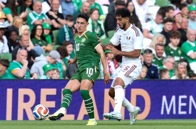 Republic of Ireland's midfilelde #10 Jamie McGrath is put under pressure by Qatar's Midfielder #05 Jassem Gaber during the international friendly football match between the Republic of Ireland and Qatar, at the Aviva Stadium in Dublin, Ireland on May 28, 2026. (Photo by Paul Faith / AFP)