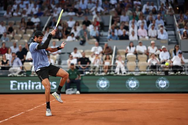 Italy's Matteo Berrettini plays a forehand return to France's Arthur Rinderknech during their men's singles match on day 5 of the French Open tennis tournament on Court Philippe-Chatrier at the Roland-Garros Complex in Paris on May 28, 2026. (Photo by Anne-Christine POUJOULAT / AFP)