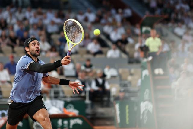 Italy's Matteo Berrettini plays a forehand return to France's Arthur Rinderknech during their men's singles match on day 5 of the French Open tennis tournament on Court Philippe-Chatrier at the Roland-Garros Complex in Paris on May 28, 2026. (Photo by Anne-Christine POUJOULAT / AFP)