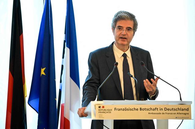 France's ambassador to Germany Franзois Delattre delivers a speech at a ceremony at the French embassy in Berlin, during which three German cultural institutions hand over seven books to the descendants of Marc Bloch (1886–1944) and his wife Simonne Vidal (1894–1944), on May 28, 2026. Marc Bloch, a member of the Resistance, was executed by the Gestapo on June 16, 1944. The restitution of the books was organized by the Berlin State Library – Prussian Cultural Heritage, with the support of the French Commission for the Restitution of Cultural Property and Compensation for the Victims of Anti-Semitic Expropriations (CIVS). (Photo by Tobias SCHWARZ / AFP)