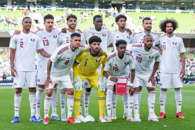 (back row from L to R) Qatar's Defender #02 Pedro Miguel, Qatar's Defender #13 Ayoub Al Oui, Qatar's Midfielder #05 Jassem Gaber Qatar's Defender #14 Homam El Amin, Qatar's Defender #16 Boualem Khoukhi and Qatar's Forward #11 Akram Afif (front row from L to R) Qatar's Midfielder #08 Edmilson Junior, Qatar's Goalkeeper #01 Mahmud Abunada, Qatar's Forward #15 Yusuf Abdurisag and Qatar's Midfielder #20 Ahmed Fathy poses for a team photo before the international friendly football match between the Republic of Ireland and Qatar, at the Aviva Stadium in Dublin, Ireland on May 28, 2026. (Photo by Paul Faith / AFP)