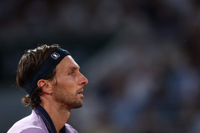 France's Arthur Rinderknech reacts to a point against Italy's Matteo Berrettini during their men's singles match on day 5 of the French Open tennis tournament on Court Philippe-Chatrier at the Roland-Garros Complex in Paris on May 28, 2026. (Photo by Anne-Christine POUJOULAT / AFP)