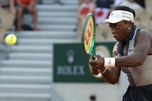 Canada's Victoria Mboko plays a backhand return to Czech Republic's Katerina Siniakova during their women's singles match on day 5 of the French Open tennis tournament on Court Simonne-Mathieu at the Roland-Garros Complex in Paris on May 28, 2026. (Photo by Thomas SAMSON / AFP)
