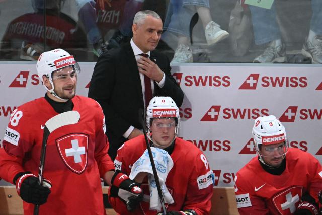 Switzerland's head coach Jan Cadieux (2nd L) reacts during the IIHF Ice Hockey Men's World Championship quarter-final match between Switzerland and Sweden at the Swiss Life Arena in Zurich, on May 28, 2026. (Photo by SEBASTIEN BOZON / AFP)
