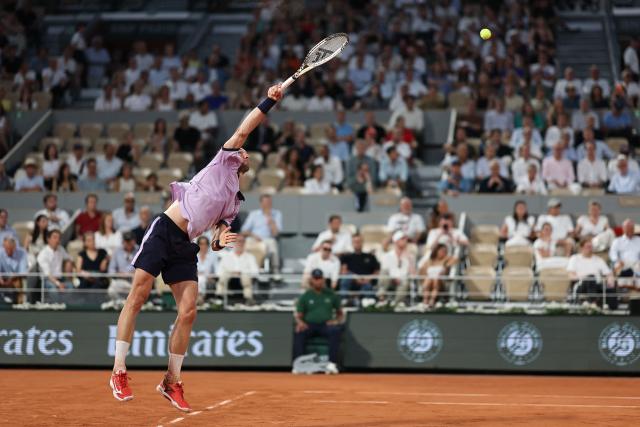 France's Arthur Rinderknech serves to Italy's Matteo Berrettini during their men's singles match on day 5 of the French Open tennis tournament on Court Philippe-Chatrier at the Roland-Garros Complex in Paris on May 28, 2026. (Photo by Anne-Christine POUJOULAT / AFP)