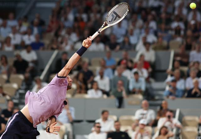 France's Arthur Rinderknech serves to Italy's Matteo Berrettini during their men's singles match on day 5 of the French Open tennis tournament on Court Philippe-Chatrier at the Roland-Garros Complex in Paris on May 28, 2026. (Photo by Anne-Christine POUJOULAT / AFP)
