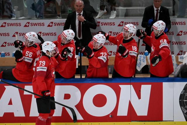 Switzerland's forward #79 Calvin Thurkauf (2nd L) celebrates scoring his team's third goal during the IIHF Ice Hockey Men's World Championship quarter-final match between Switzerland and Sweden at the Swiss Life Arena in Zurich, on May 28, 2026. (Photo by SEBASTIEN BOZON / AFP)