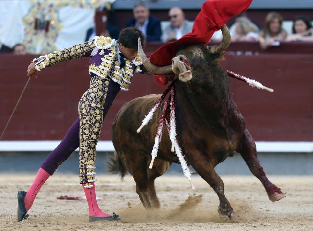 Peruvian bullfighter Andres Roca Rey performs a pass to a bull during the San Isidro Fair at Las Ventas bullring in Madrid on May 28, 2026. (Photo by ALBERTO SIMON / AFP)