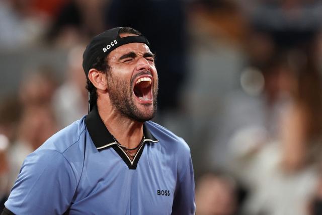 Italy's Matteo Berrettini celebrates his victory at the end of his men's singles match against France's Arthur Rinderknech on day 5 of the French Open tennis tournament on Court Philippe-Chatrier at the Roland-Garros Complex in Paris on May 28, 2026. (Photo by Anne-Christine POUJOULAT / AFP)