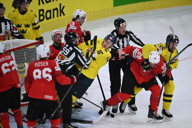 Sweden's forward #15 Jack Berglund (C) scuffles with Switzerland's forward #28 Timo Meier (2nd R) during the IIHF Ice Hockey Men's World Championship quarter-final match between Switzerland and Sweden at the Swiss Life Arena in Zurich, on May 28, 2026. (Photo by SEBASTIEN BOZON / AFP)