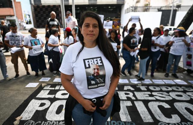 Andreina Baduel, sister of political prisoner Josnar Baduel, protests alongside relatives of other political prisoners outside the Public Prosecutor's Office in Caracas on May 28, 2026, calling for their release. (Photo by Juan BARRETO / AFP)