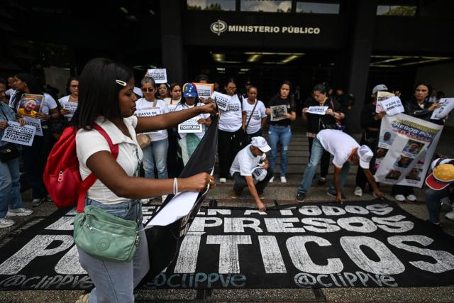 Relatives of political prisoners protest outside the Public Prosecutor's Office in Caracas on May 28, 2026, calling for the release of their loved ones. (Photo by Juan BARRETO / AFP)