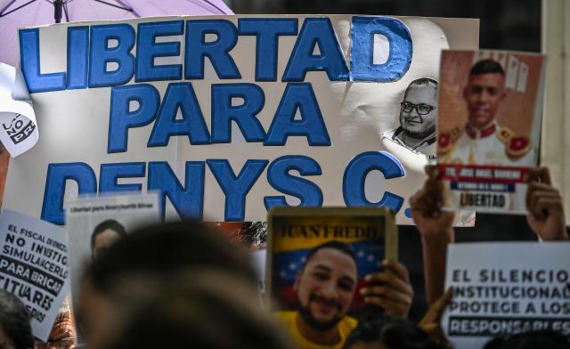 Relatives of political prisoners protest outside the Public Prosecutor's Office in Caracas on May 28, 2026, calling for the release of their loved ones. (Photo by Juan BARRETO / AFP)