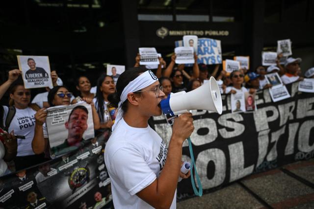 Relatives of political prisoners protest outside the Public Prosecutor's Office in Caracas on May 28, 2026, calling for the release of their loved ones. (Photo by Juan BARRETO / AFP)
