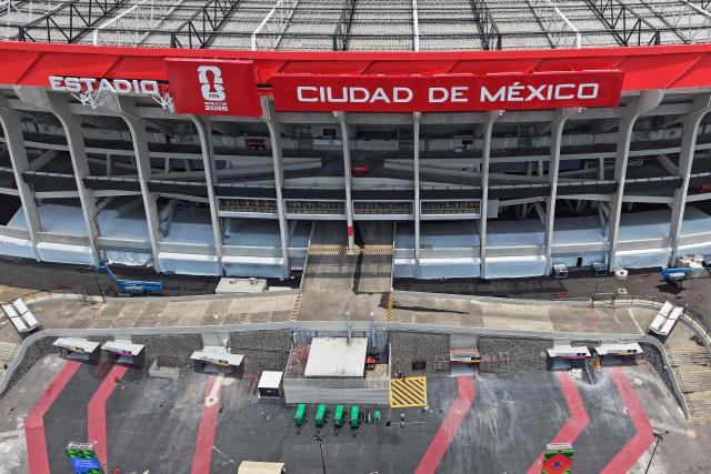 This aerial view shows the Mexico City Stadium, renamed from Azteca Stadium (or Banorte Stadium) for the FIFA World Cup, in Mexico City on May 28, 2026. FIFA temporarily branded the iconic Azteca Stadium as "Mexico City Stadium" for the 2026 World Cup, enforcing a strict "debranding" policy that requires all host stadiums to remove or cover non-official corporate sponsor names, suite branding, and external logos. (Photo by Carl DE SOUZA / AFP)