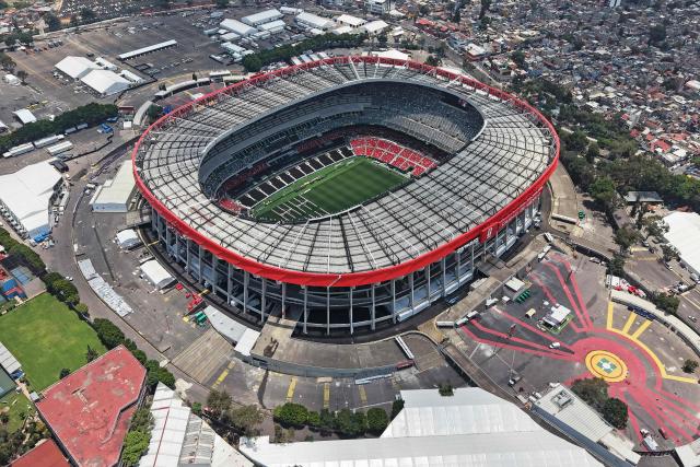 This aerial view shows the Mexico City Stadium, renamed from Azteca Stadium (or Banorte Stadium) for the FIFA World Cup, in Mexico City on May 28, 2026. FIFA temporarily branded the iconic Azteca Stadium as "Mexico City Stadium" for the 2026 World Cup, enforcing a strict "debranding" policy that requires all host stadiums to remove or cover non-official corporate sponsor names, suite branding, and external logos. (Photo by Carl DE SOUZA / AFP)
