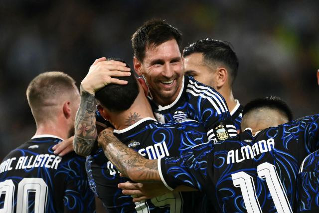 (FILES) Argentina's defender #19 Nicolas Otamendi celebrates with teammate forward #10 Lionel Messi after scoring his team's third goal during a friendly football match between Argentina and Zambia at La Bombonera stadium in Buenos Aires on March 31, 2026. Lionel Messi will captain Argentina at the World Cup, national head coach Lionel Scaloni announced on May 28, 2026, as he unveiled his 26-man squad. Messi, 38, heads the list on his sixth World Cup appearance, which notably omits Real Madrid's Franco Mastantuono. (Photo by Luis ROBAYO / AFP)