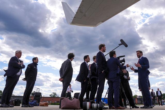 US Vice President JD Vance (R) speaks with reporters under the wing of Air Force Two after his arrival at Joint Base Andrews in Maryland, on May 28, 2026 on his return from Colorado where he attended the 2026 graduation ceremony at the US Air Force Academy. (Photo by Matt Rourke / POOL / AFP)