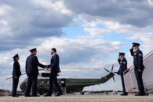 US Vice President JD Vance (C) is welcomed at Joint Base Andrews in Maryland, on May 28, 2026 on his return from Colorado where he attended the 2026 graduation ceremony at the US Air Force Academy. (Photo by Matt Rourke / POOL / AFP)