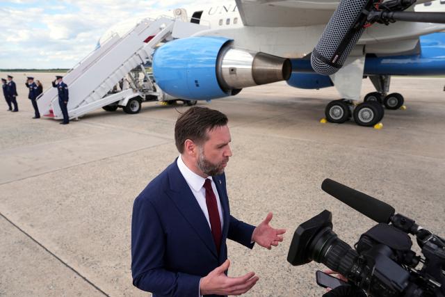 US Vice President JD Vance (R) speaks with reporters after his arrival at Joint Base Andrews in Maryland, on May 28, 2026 on his return from Colorado where he attended the 2026 graduation ceremony at the US Air Force Academy. (Photo by Matt Rourke / POOL / AFP)
