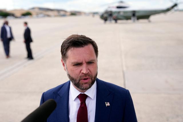 US Vice President JD Vance (R) speaks with reporters after his arrival at Joint Base Andrews in Maryland, on May 28, 2026 on his return from Colorado where he attended the 2026 graduation ceremony at the US Air Force Academy. (Photo by Matt Rourke / POOL / AFP)
