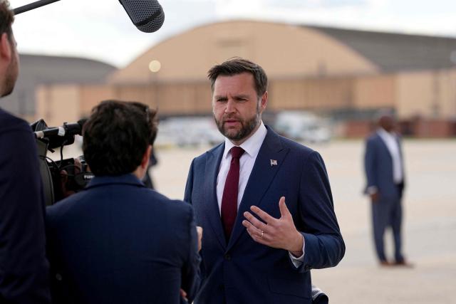 US Vice President JD Vance (R) speaks with reporters after his arrival at Joint Base Andrews in Maryland, on May 28, 2026 on his return from Colorado where he attended the 2026 graduation ceremony at the US Air Force Academy. (Photo by Matt Rourke / POOL / AFP)