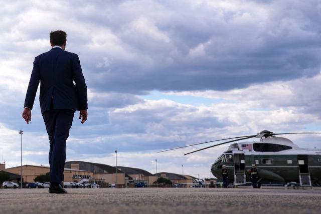 US Vice President JD Vance (L) walks to board Marine Two after his arrival at Joint Base Andrews in Maryland, on May 28, 2026 on his return from Colorado where he attended the 2026 graduation ceremony at the US Air Force Academy. (Photo by Matt Rourke / POOL / AFP)