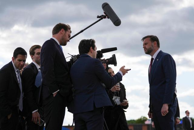 US Vice President JD Vance (R) speaks with reporters after his arrival at Joint Base Andrews in Maryland, on May 28, 2026 on his return from Colorado where he attended the 2026 graduation ceremony at the US Air Force Academy. (Photo by Matt Rourke / POOL / AFP)