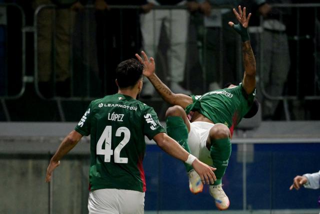 Palmeiras' forward #40 Allan (R) celebrates after scoring his team's second goal during the Copa Libertadores group stage football match between Brazil's Palmeiras and Colombia's Junior at the Allianz Parque stadium in Sao Paulo, Brazil on May 28, 2026. (Photo by NELSON ALMEIDA / AFP)